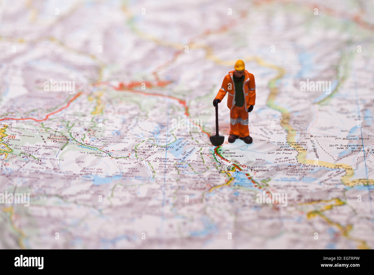 Miniature people on a map Stock Photo - Alamy