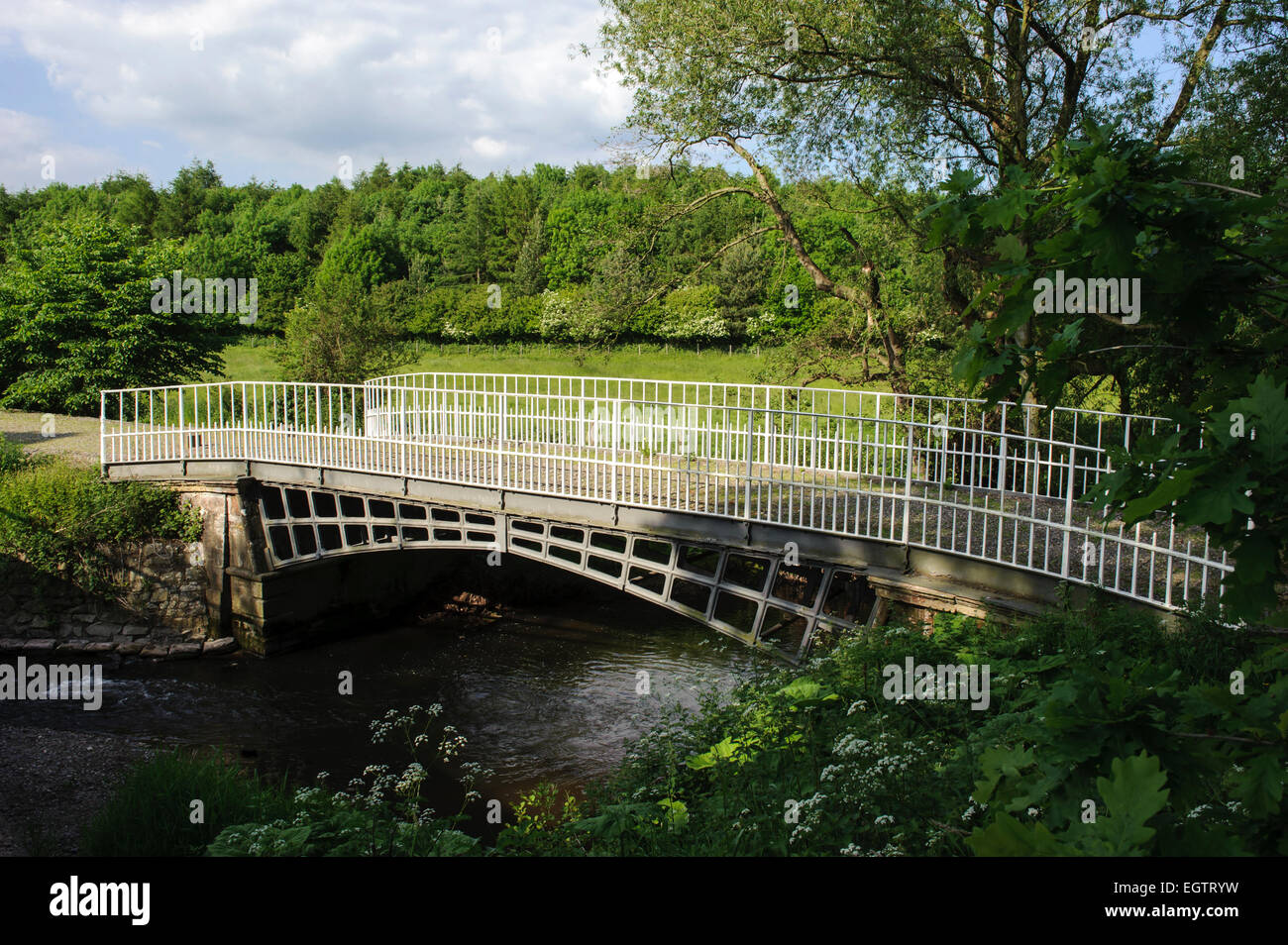 Cantlop Bridge (Built 1813) is a cast Iron single span road bridge over the Cound Brook, Cantlop, Shropshire. Stock Photo