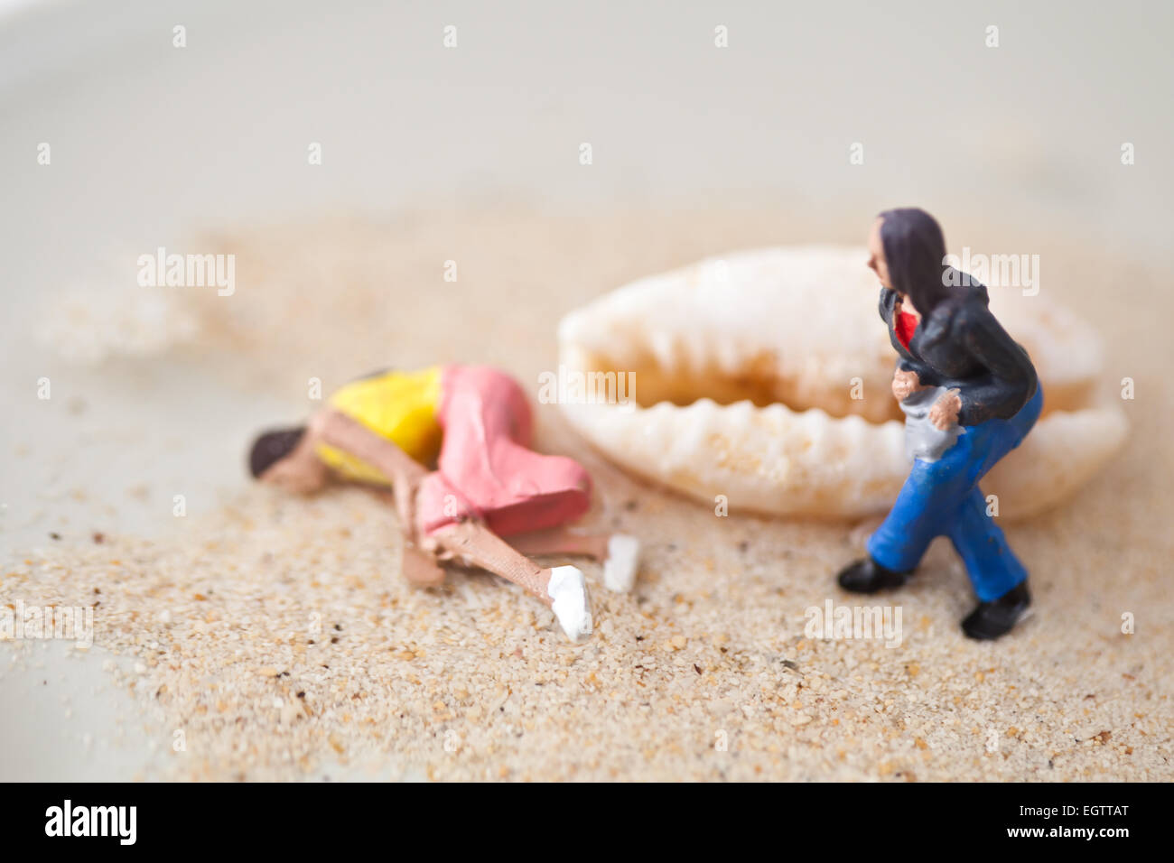 Miniature people in action in various situations Stock Photo