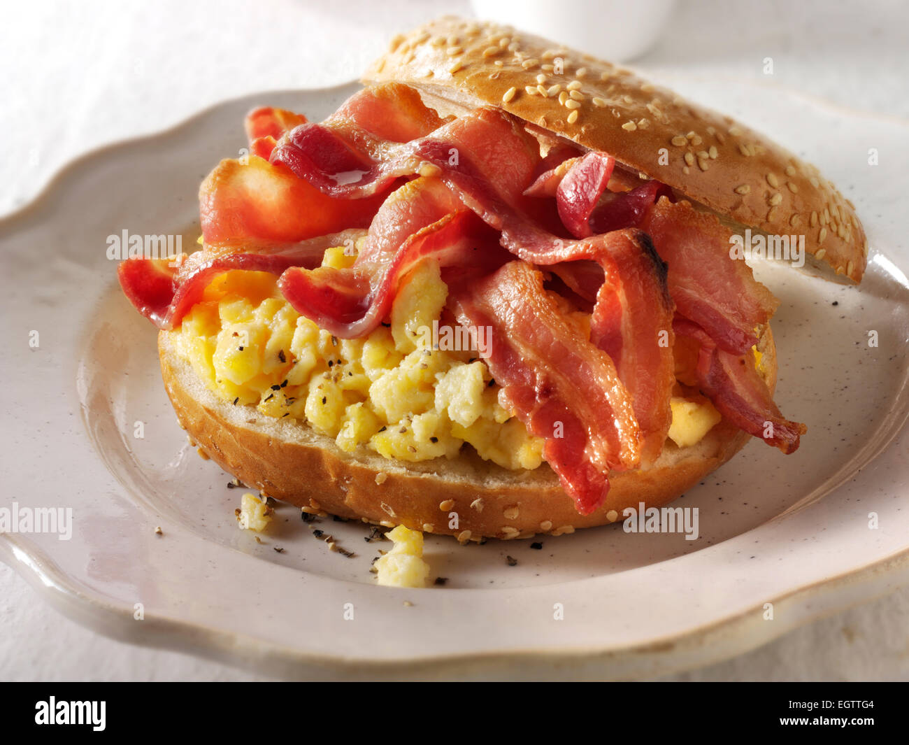 Crispy Streaky Bacon And Scrambled Eggs On A Bagel Stock Photo Alamy