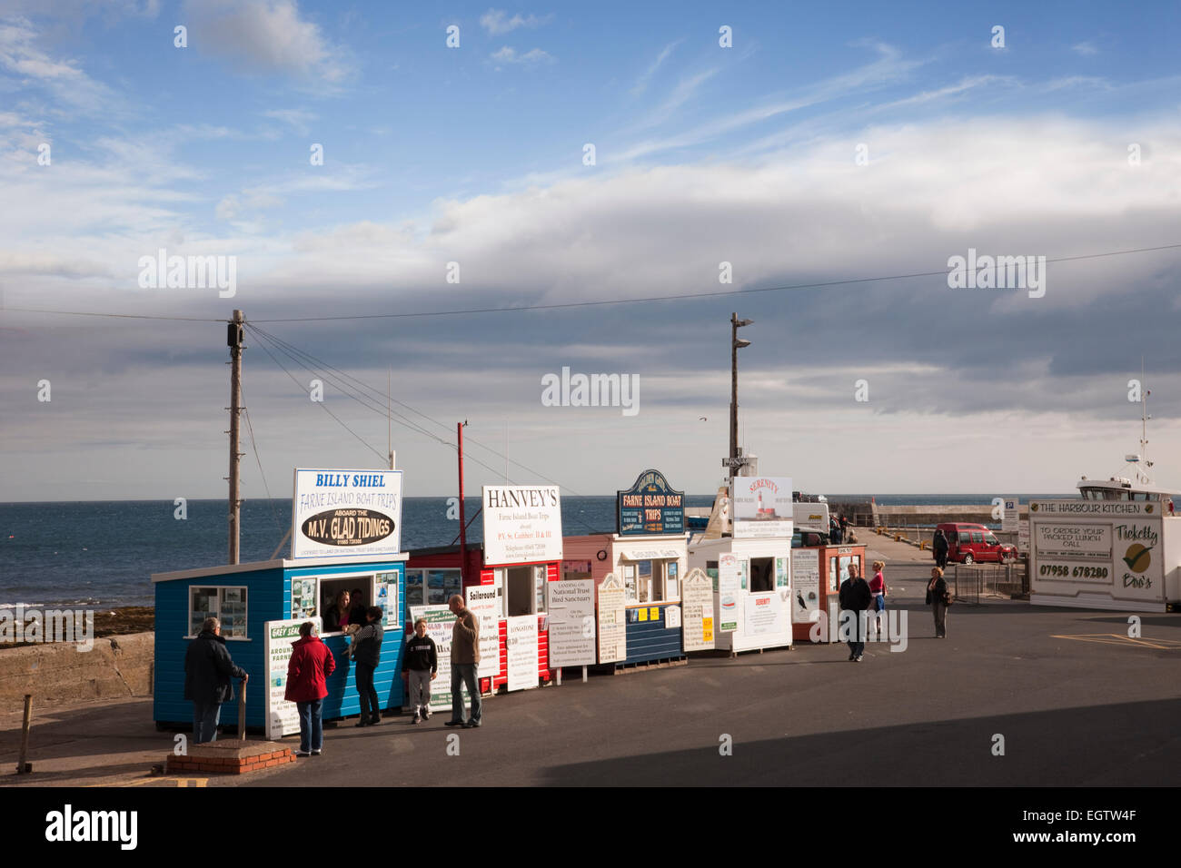 Seafront kiosks for booking Farne Island boat trips from the harbour. Seahouses, Northumberland, England, UK, Britain. Stock Photo