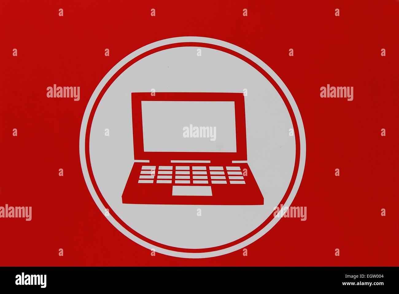 on a red background shows the icon laptop Stock Photo - Alamy