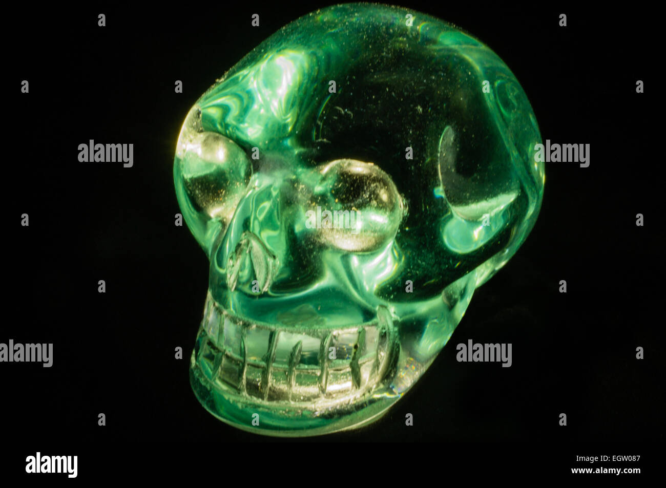 A crystal skull on a black background Stock Photo