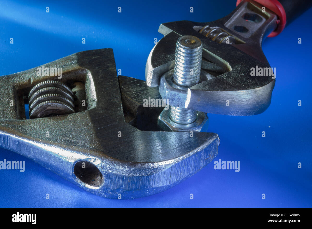 Adjustable wrench and bolt with nuts. Stock Photo