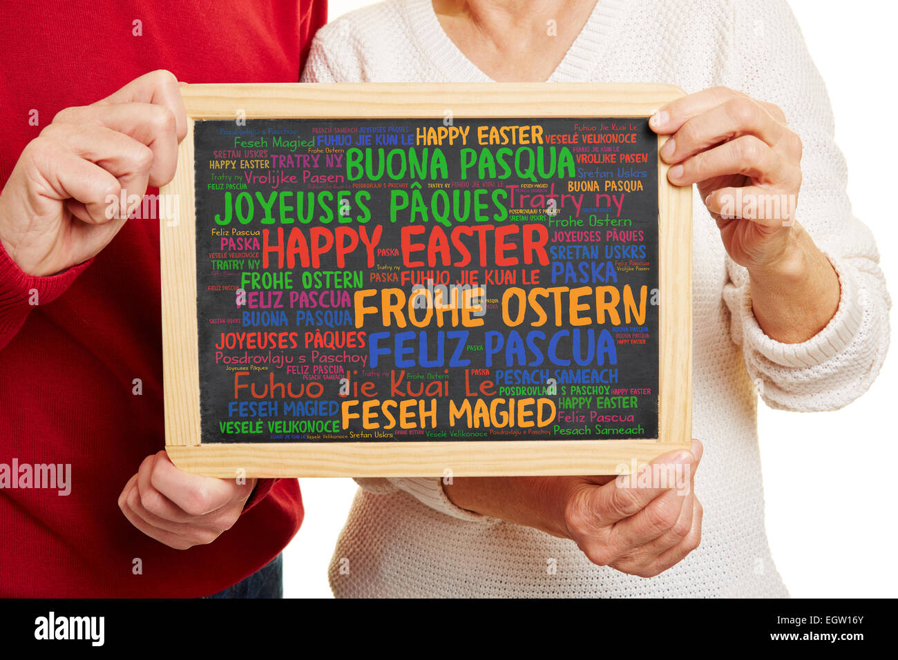 Happy Easter greetings in many different languages on a blackboard