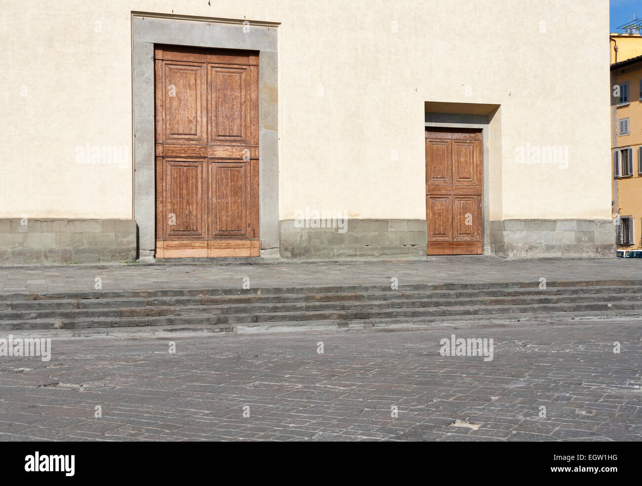 Basilica of the Holy Spirit facade doors in Florence, Italy Stock Photo