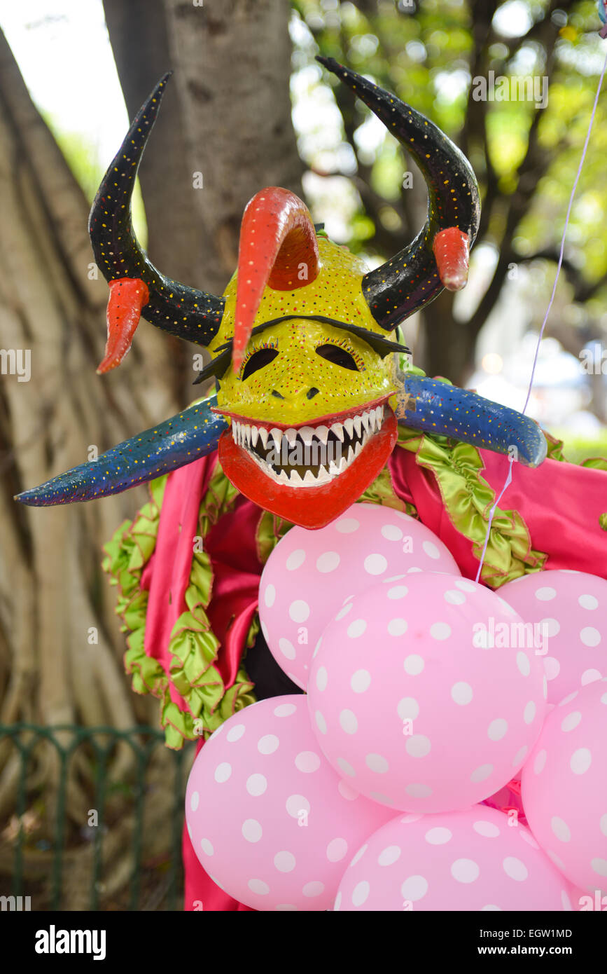 Masked cultural figure vejigante posing during the carnival in Ponce, Puerto Rico 2015 Stock Photo