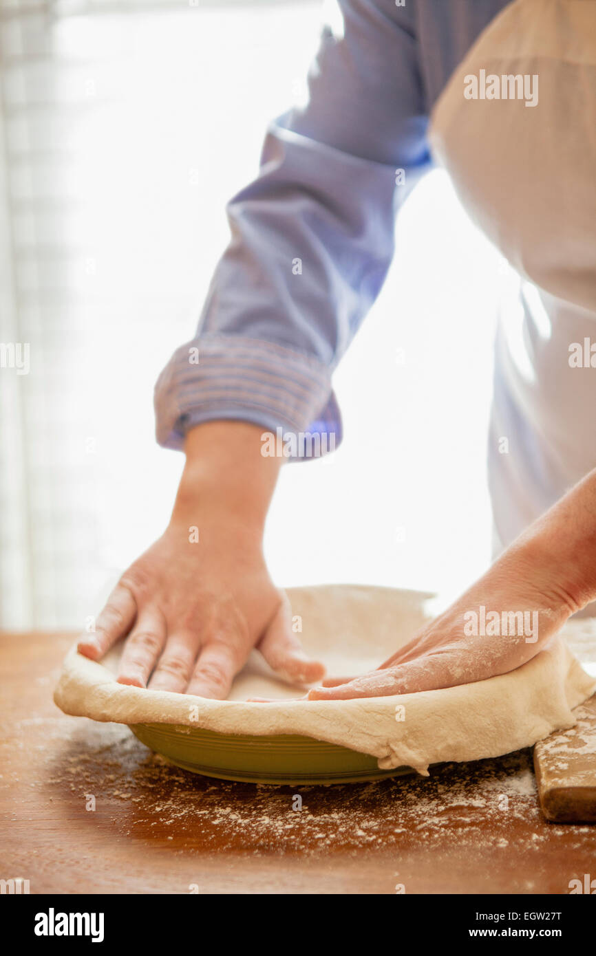 Woman making pie crust. Stock Photo