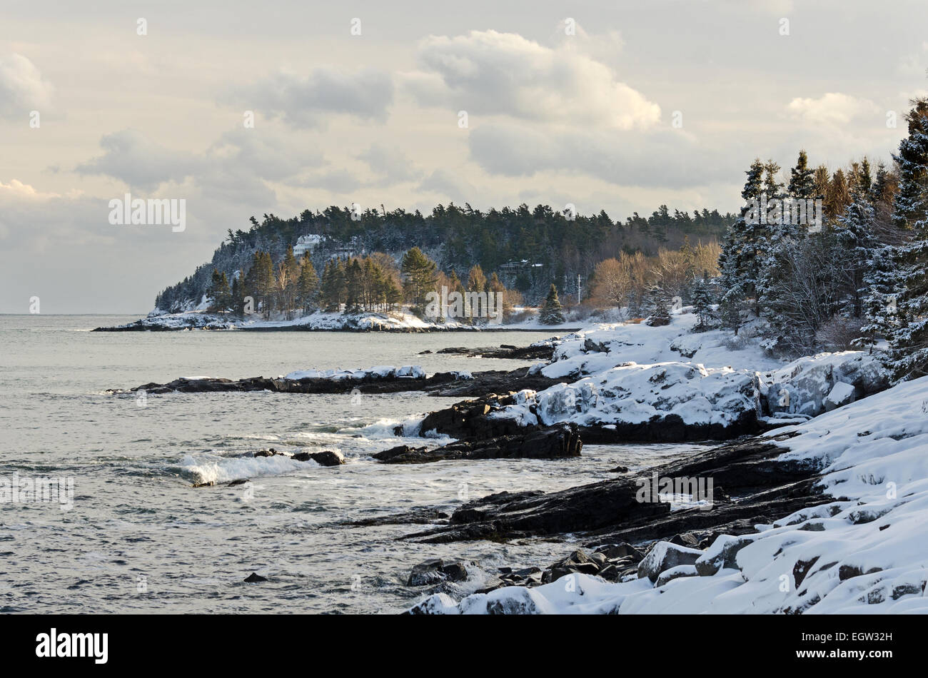 Snow covers the rocky shores of Bar Harbor, Maine on a bitterly cold