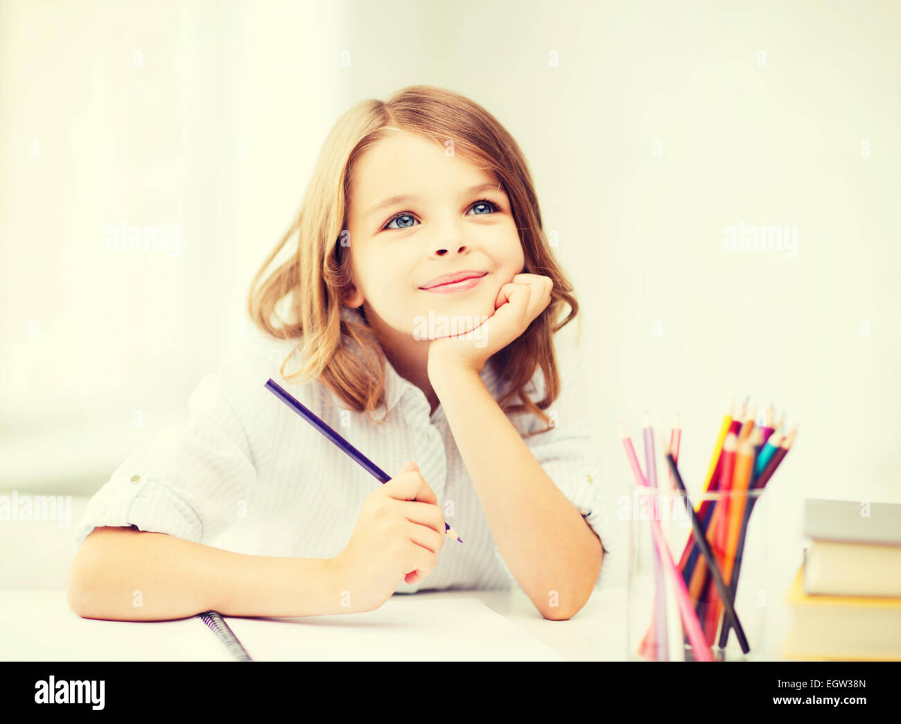 girl drawing with pencils at school Stock Photo - Alamy