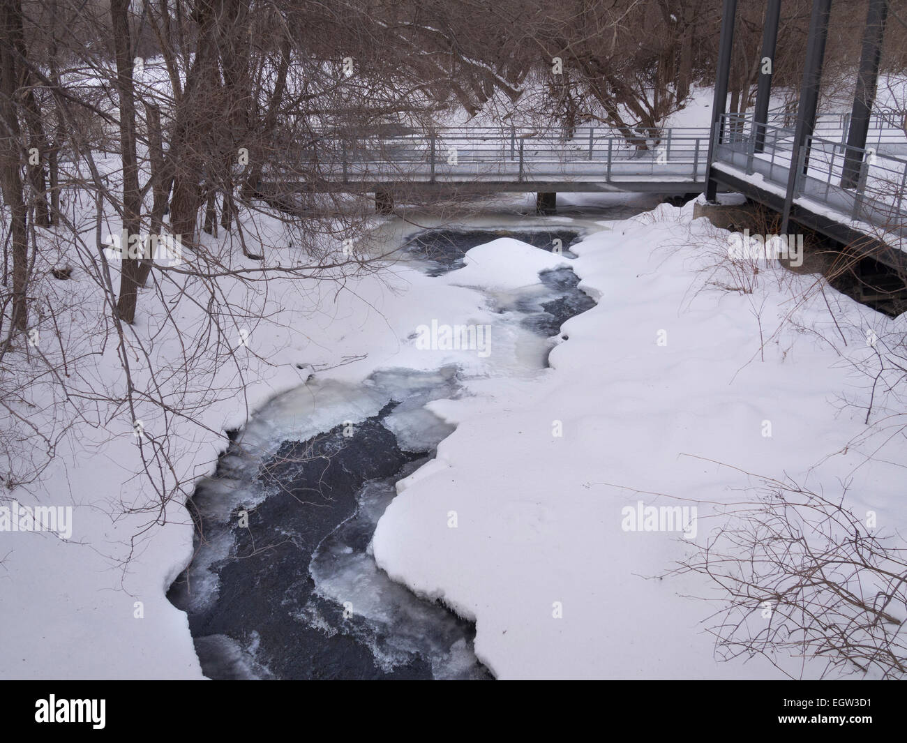 Water with bridge on a winter day Stock Photo