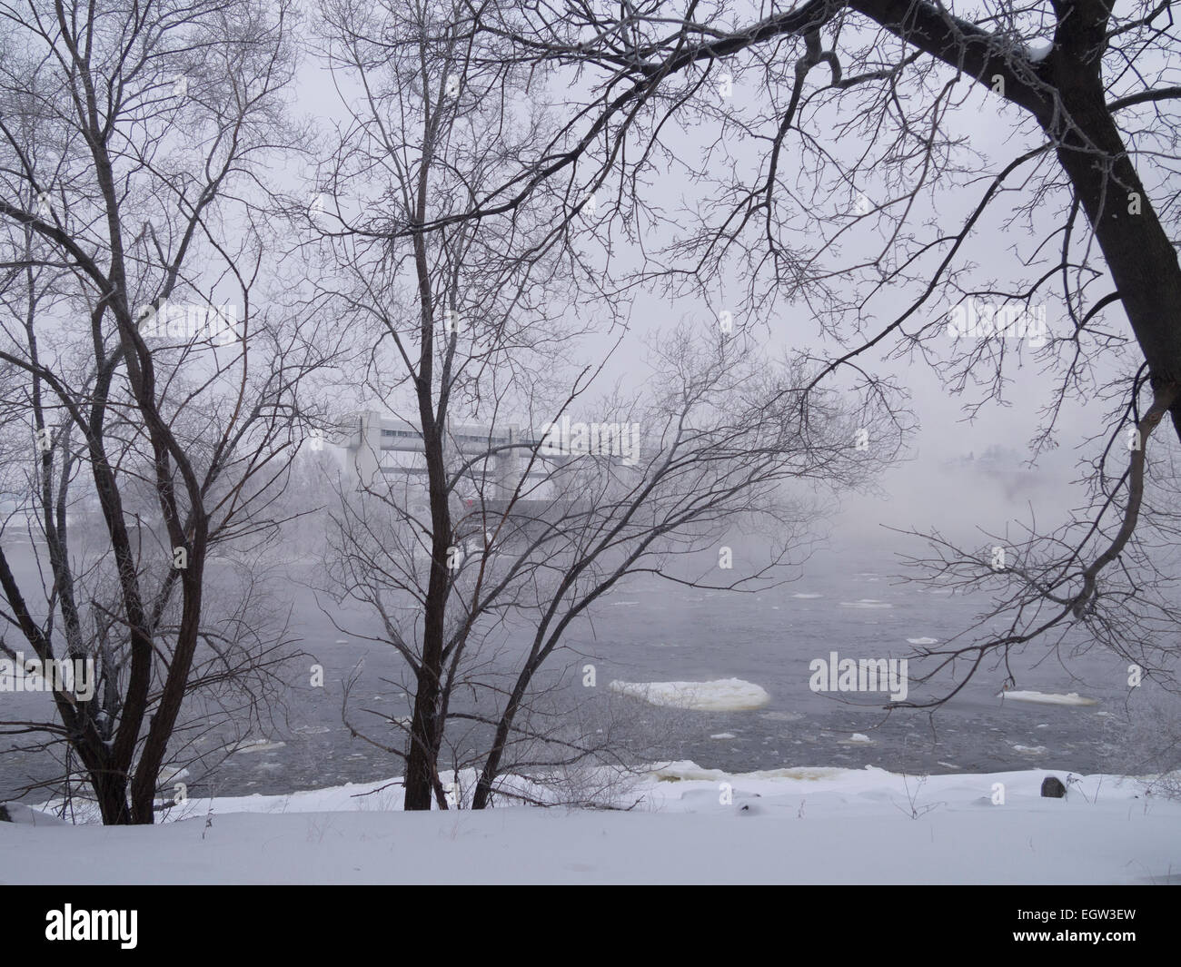 Fog on the river on an overcast day in winter Stock Photo