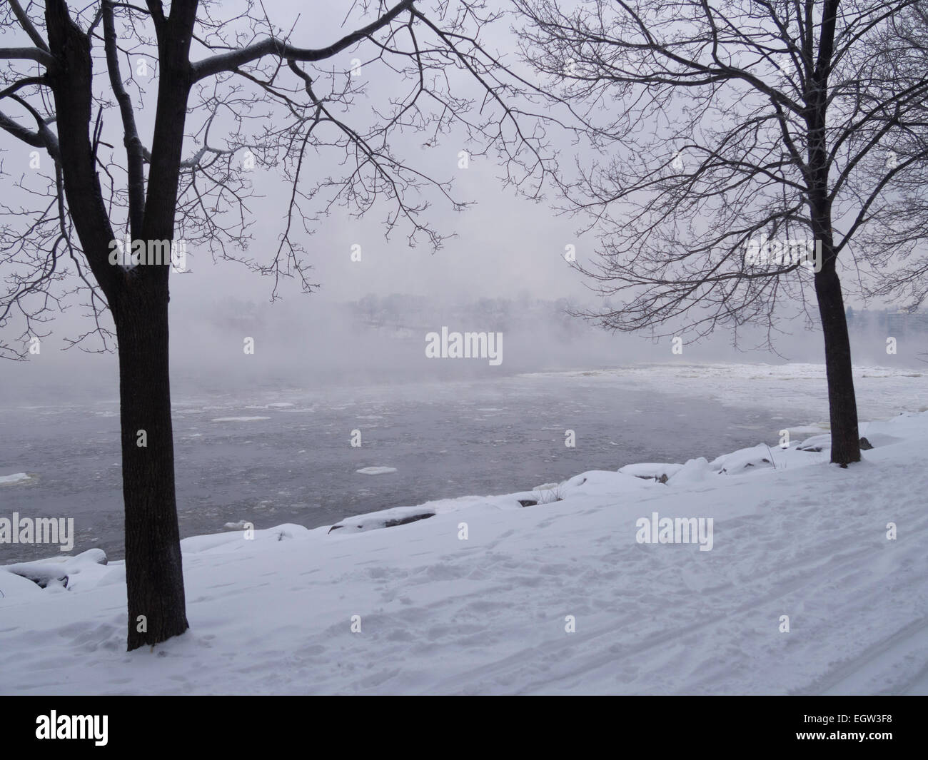 Fog on the river with ski traces on an overcast day in winter Stock Photo