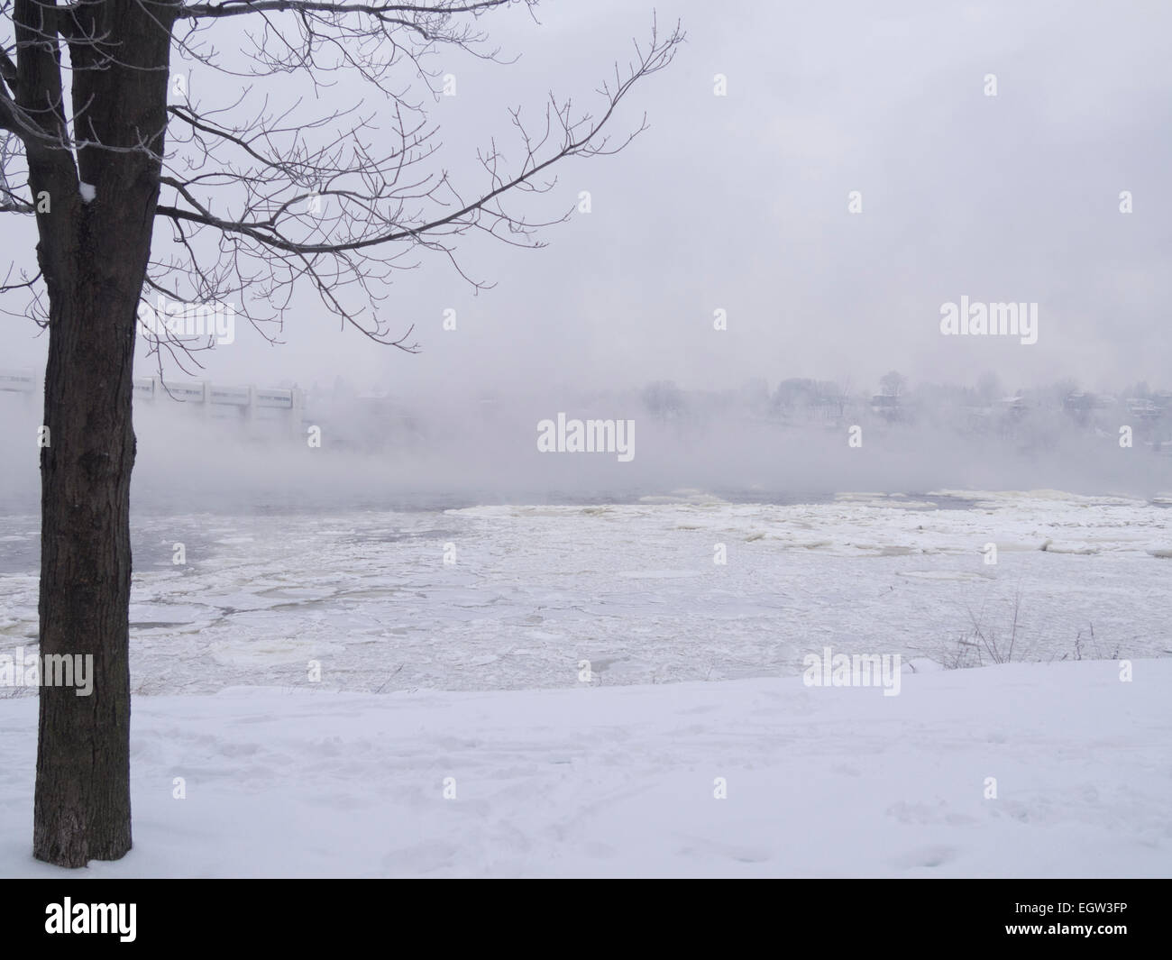 Fog on the river on an overcast day in winter Stock Photo