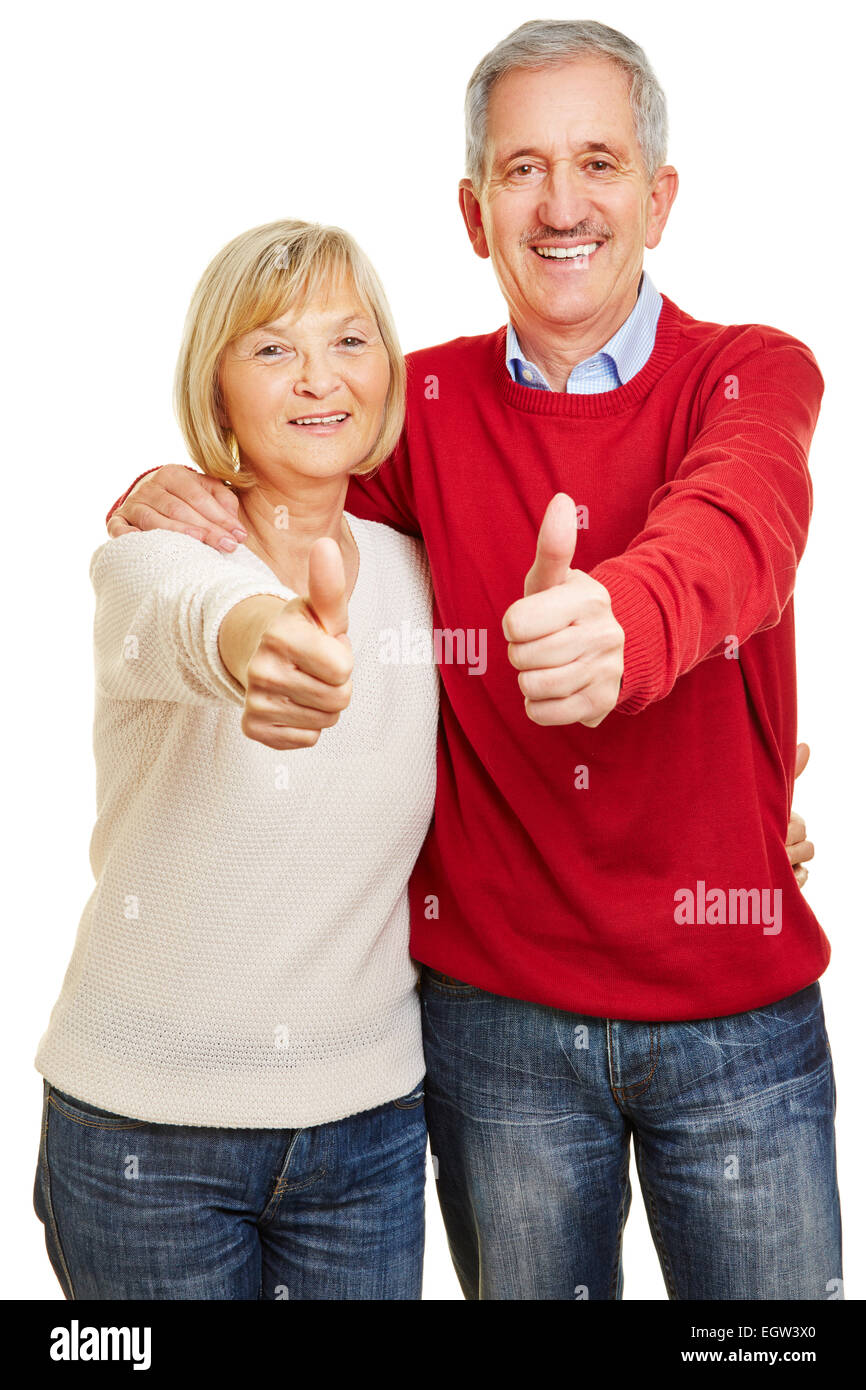 Happy senior couple holding thumbs up together Stock Photo