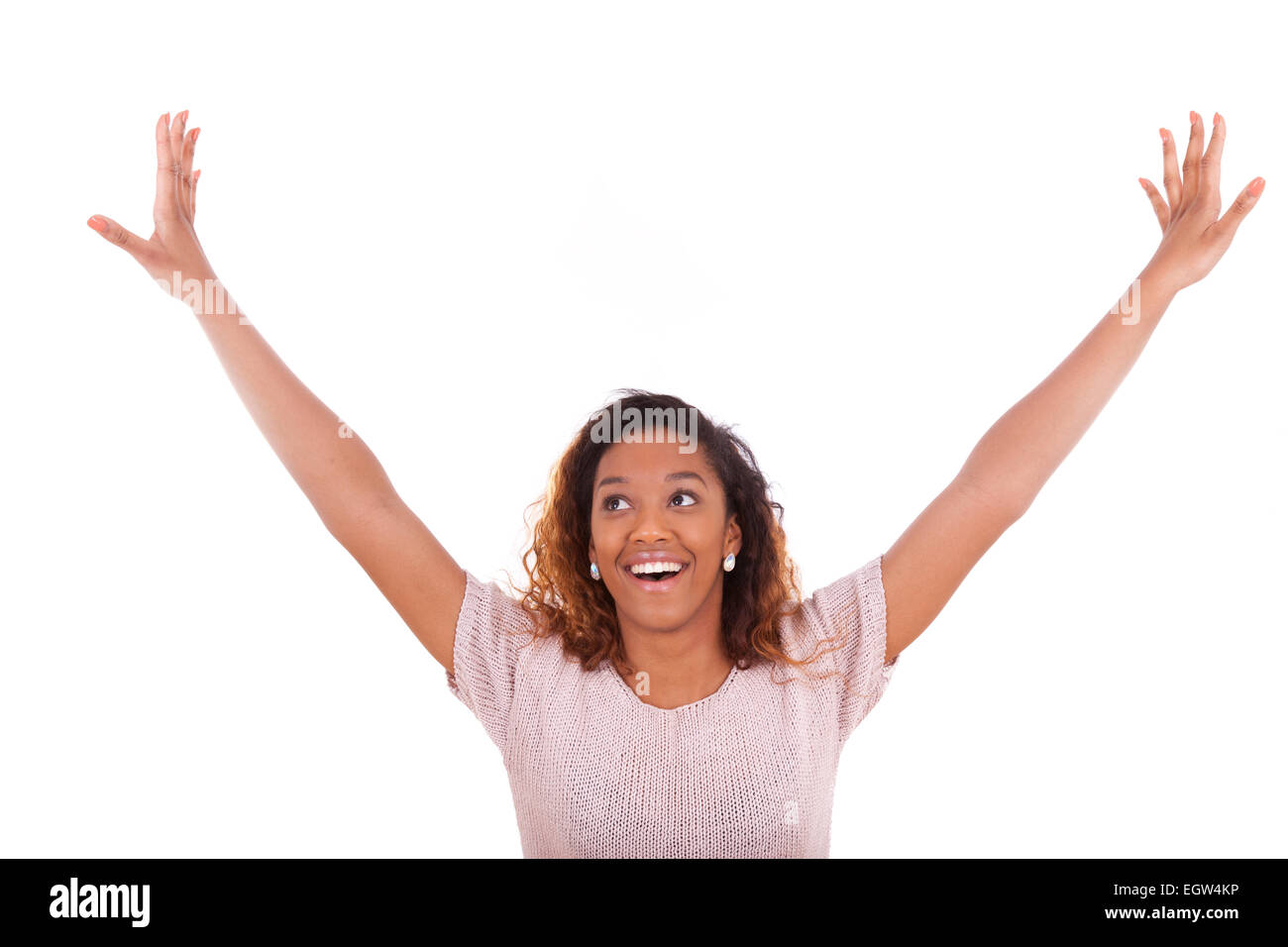 Successful african american woman with arms up expressing her joy ...