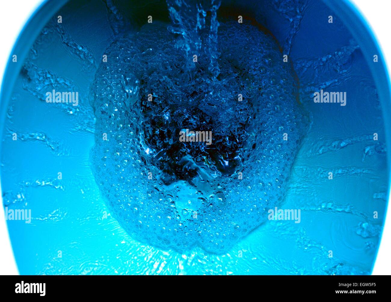 A domestic toilet flushing water.Digitally colored Stock Photo