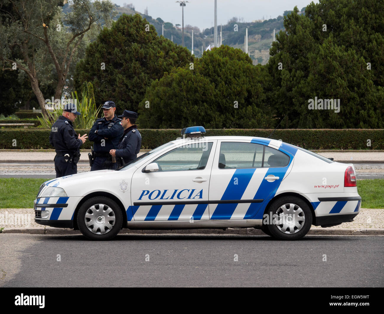 Three portuguese police officers next to a police car in Lisbon, Portugal  Stock Photo - Alamy