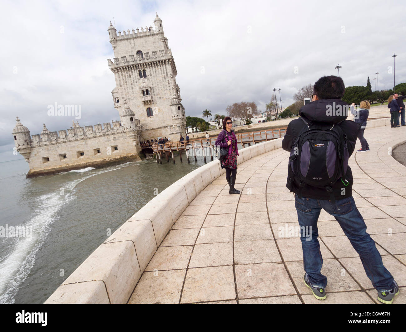 Tourists taking photos in front of the Belem Tower or Torre de Belém in Lisbon, Portugal, Europe Stock Photo