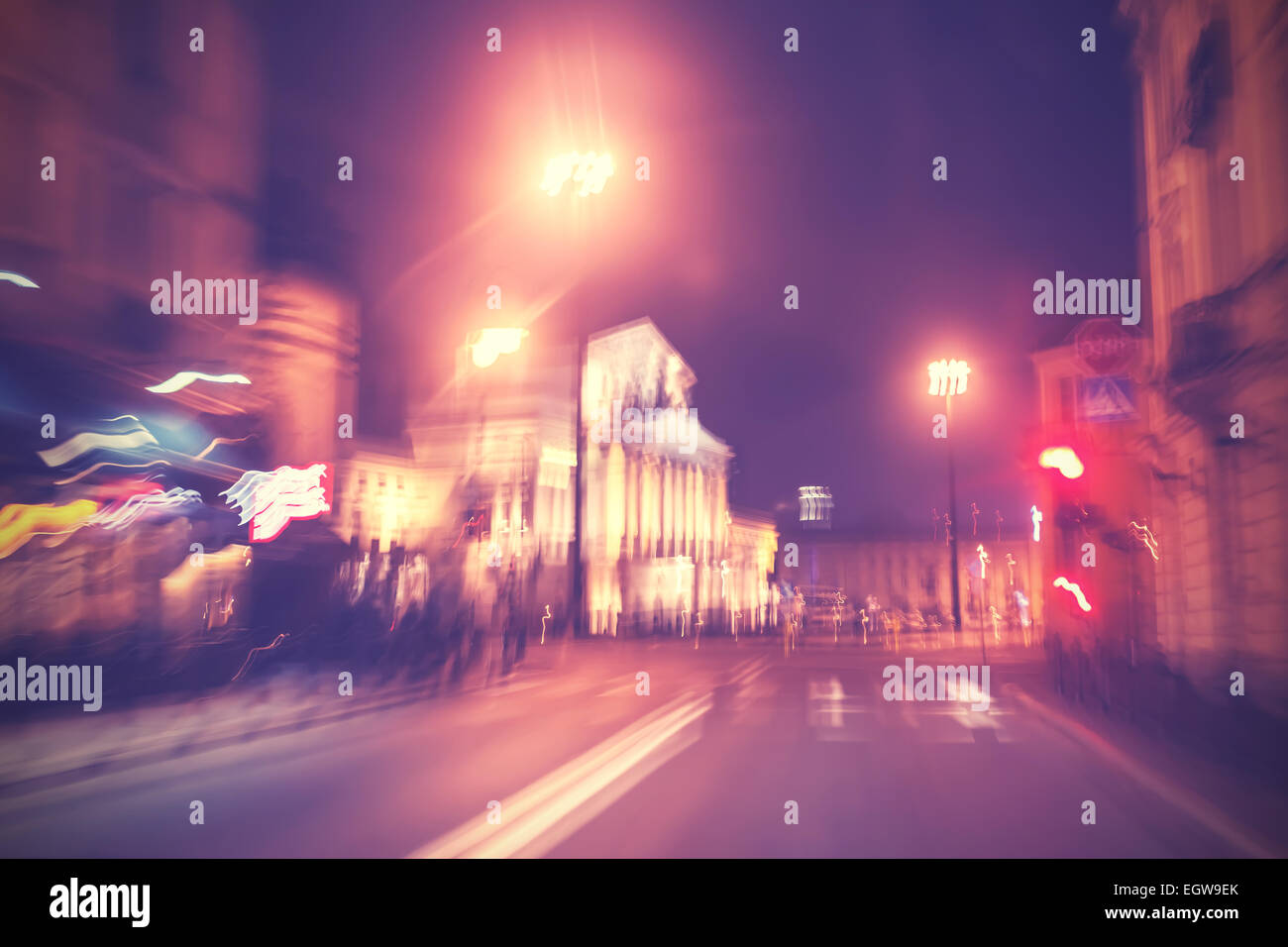 Retro filtered city traffic lights in motion blur. Stock Photo