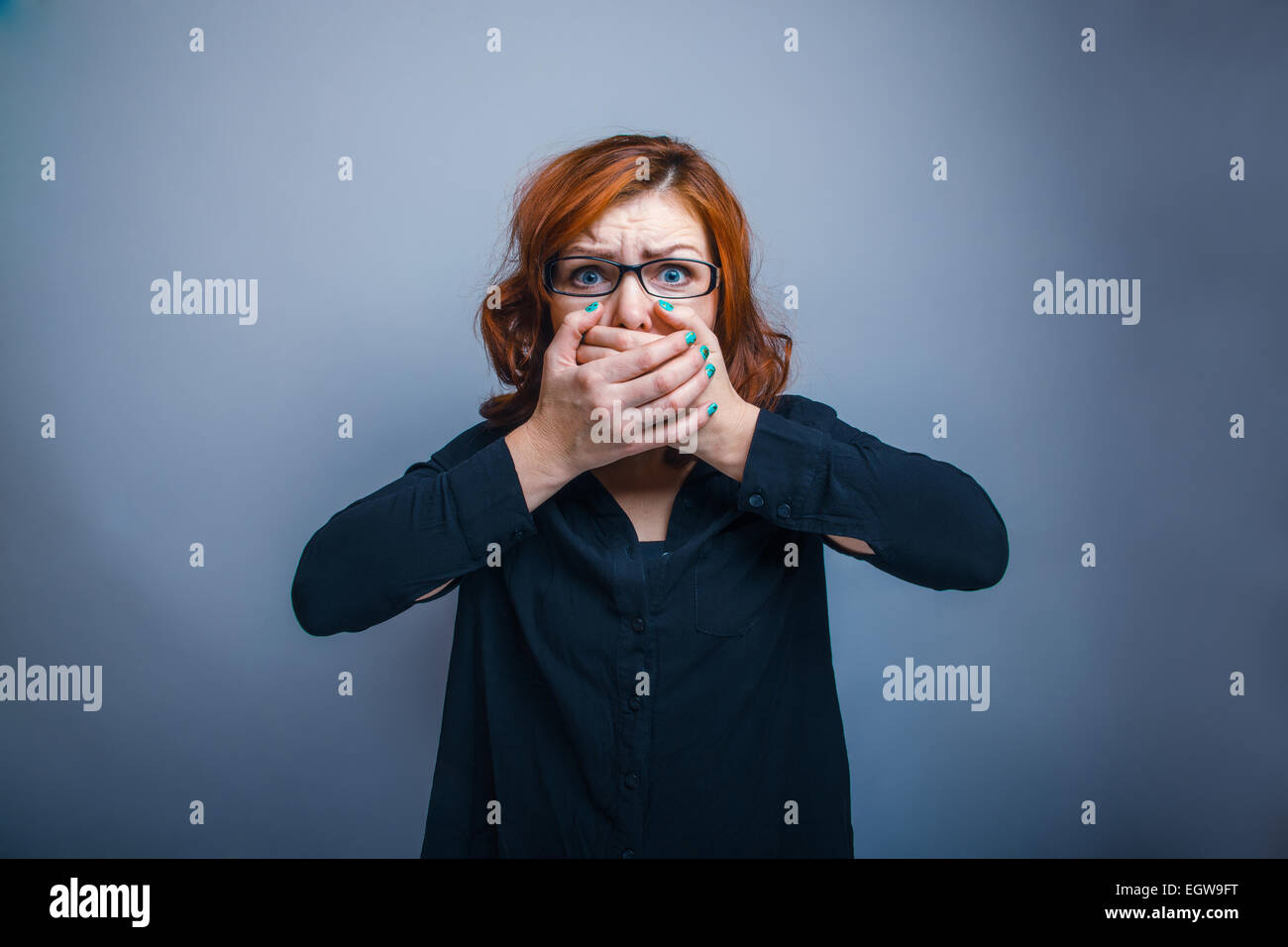 European-looking woman of thirty years in glasses, closed his mo Stock Photo