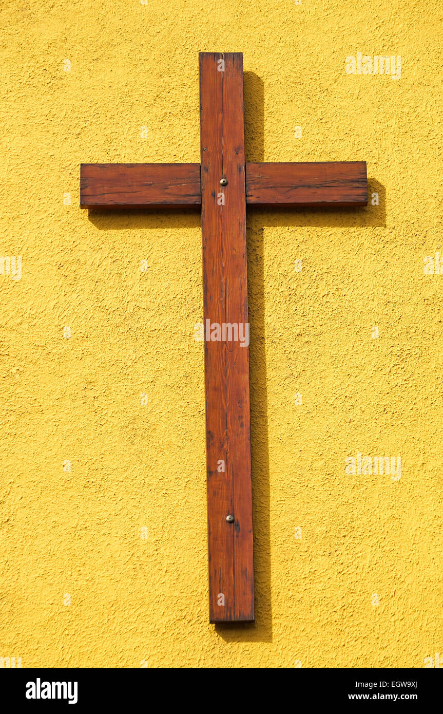 Wooden cross on the wall of the church Stock Photo - Alamy