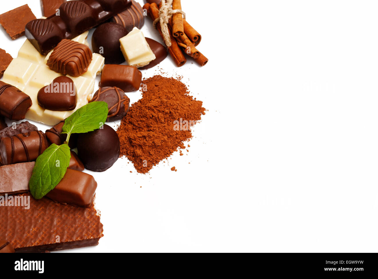 Many chocolate and cinnamon isolated on white background Stock Photo