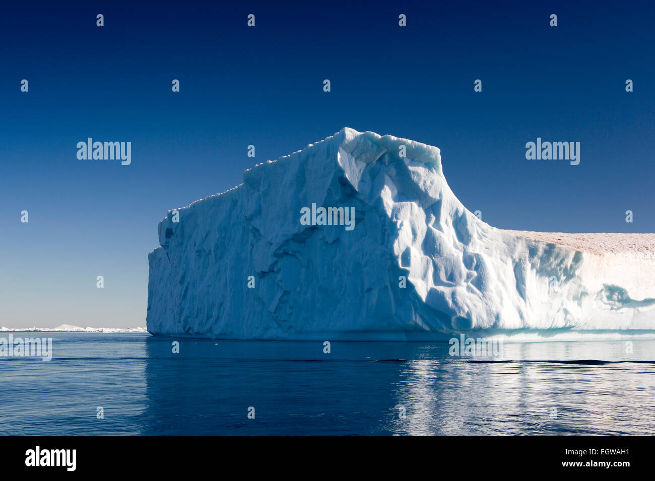 Antarctica, Weddell Sea, large Antarctic tabular iceberg towering high above sea Stock Photo