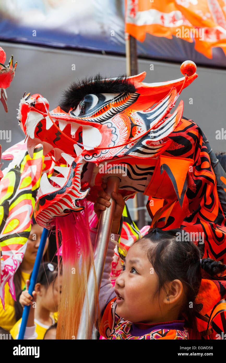 China, Hong Kong, Annual New Years Day Festival Parade, Child Holding