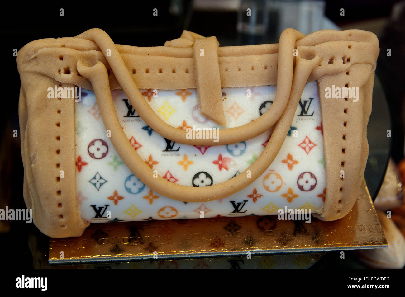 PARIS, FRANCE - DEC 23, 2017: Luxury Louis Vuitton Handbag Made From  Exclusive Leather On Sale During Winter Christmas Holidays In Paris, France  And Golden LV Logo Stock Photo, Picture and Royalty