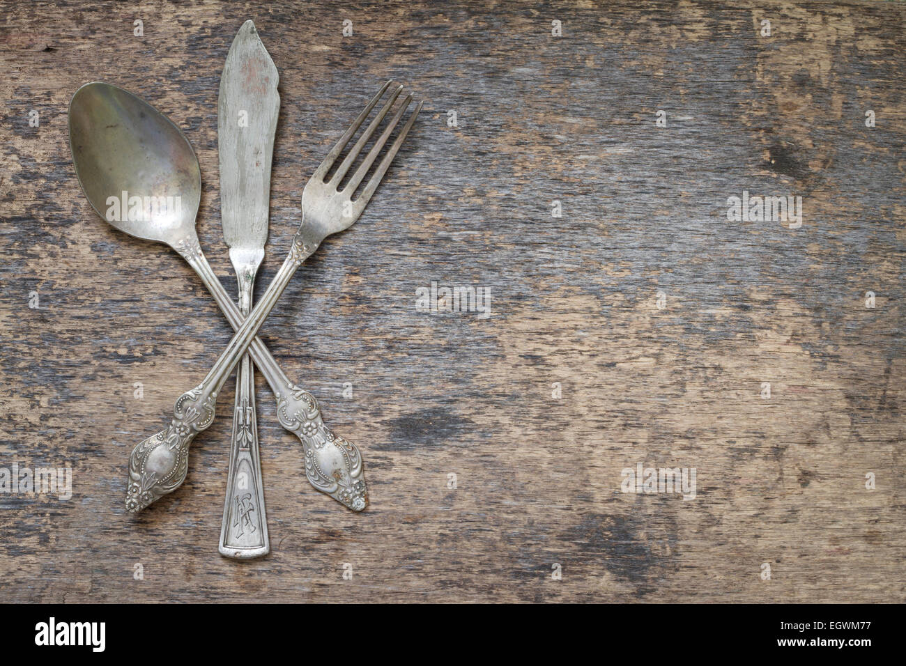 Old vintage cutlery and dishware abstract food background Stock Photo