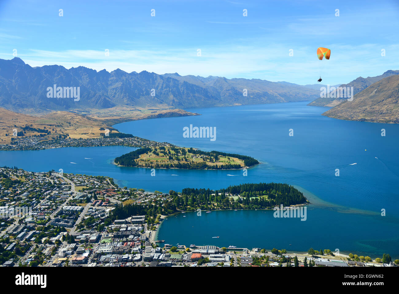 Tandem Paragliding over Queenstown (adventure capital of the World), on the shores of Lake Wakatipu, South Island, New Zealand. Stock Photo