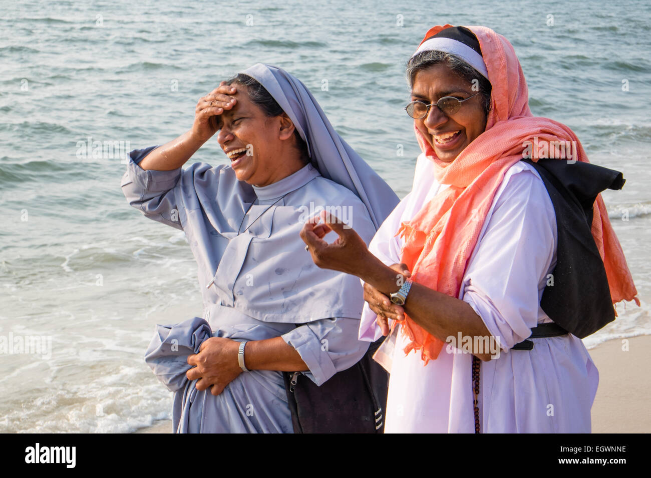 Christian Kerala - Catholic nuns enjoying the beach at Alleppey, India Stock Photo