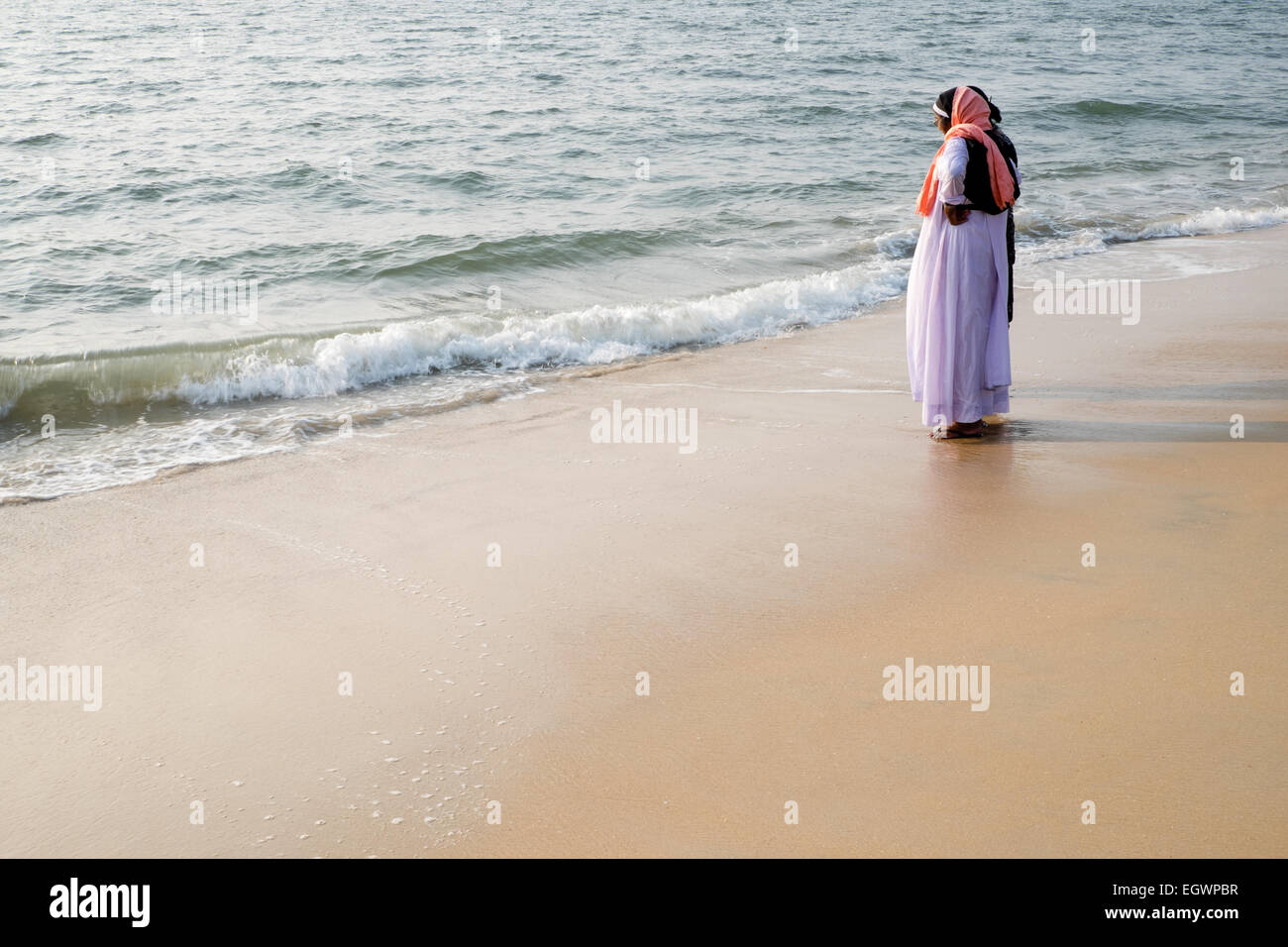 Christian Kerala - Catholic nuns enjoying the beach at Alleppey, India Stock Photo