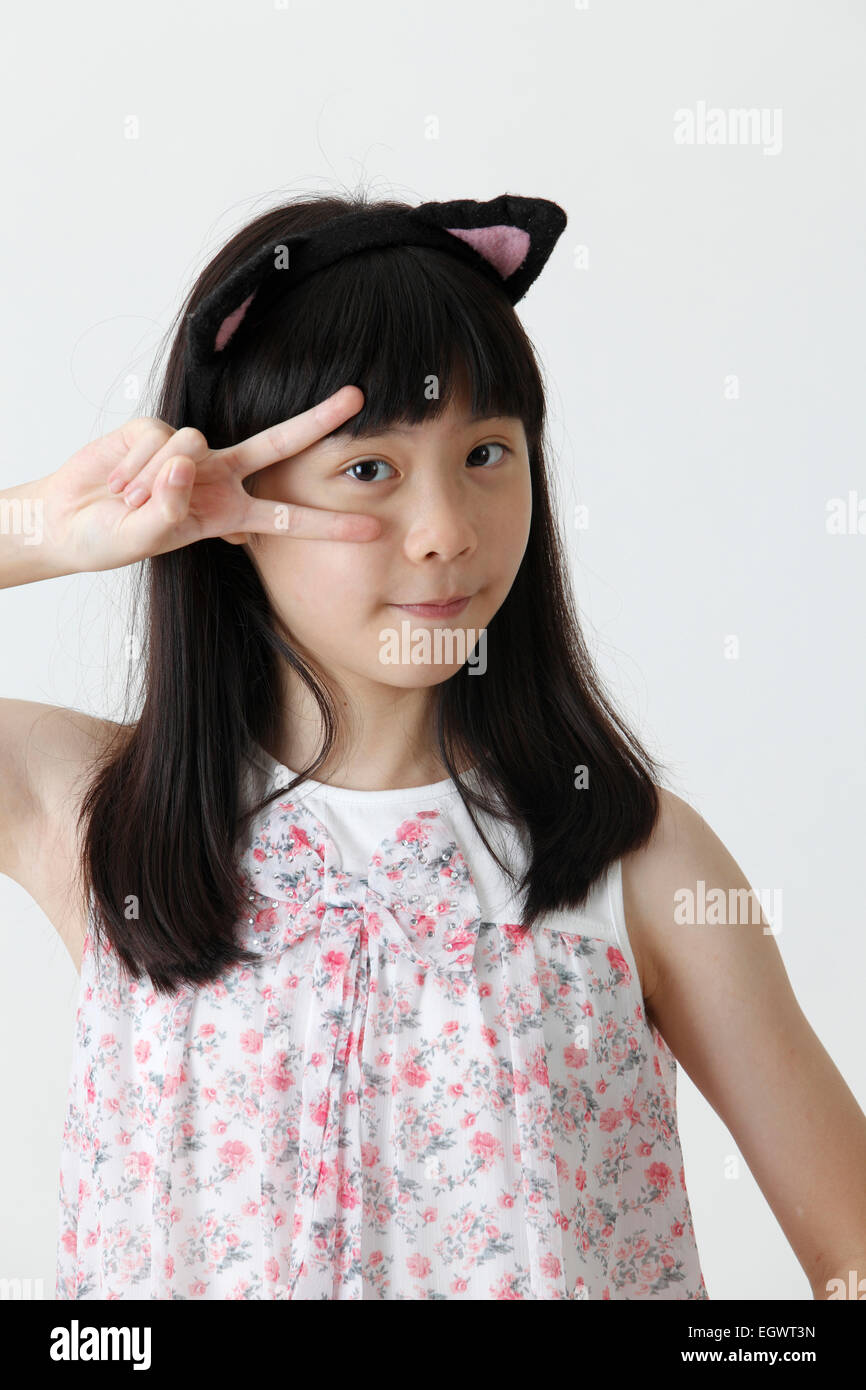 chinese girl wearing cute hair band looking at camera Stock Photo - Alamy