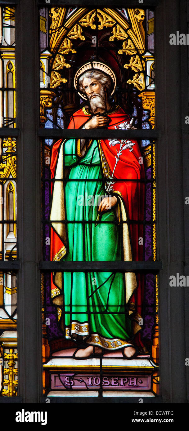 Stained Glass window depicting Saint Joseph in the Cathedral of Brussels, Belgium. Stock Photo