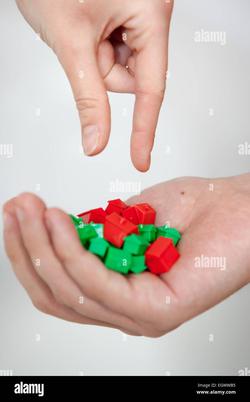 Selecting a monopoly house. Stock Photo