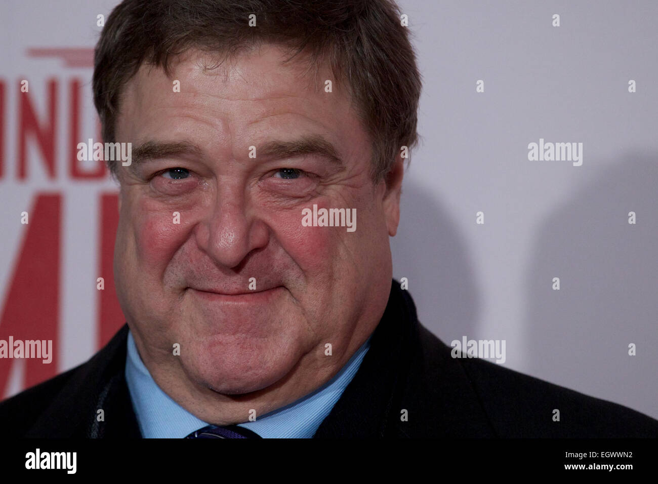 UNITED KINGDOM, London : American actor John Goodman poses for a photo call in front of 'Cupid complaining to Venus' by Lucas Cranach which was a painting that belonged in Hitlers private collection, in conjunction with the film 'The Monument men' in central London on February 11, 2014 Stock Photo