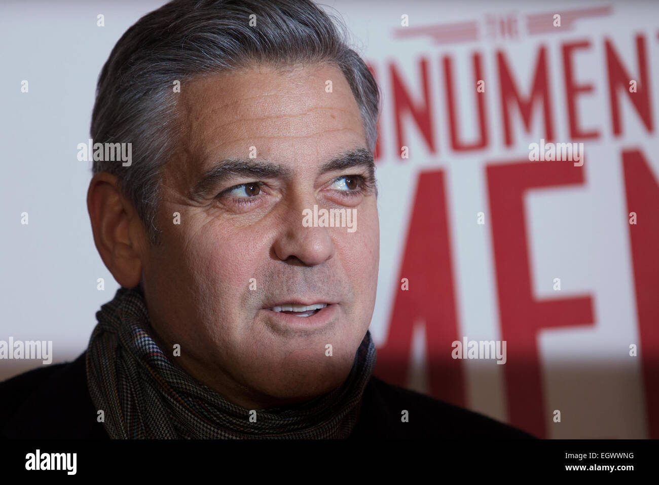 UNITED KINGDOM, London : American actor George Clooney poses for a photo call in front of 'Cupid complaining to Venus' by Lucas Cranach which was a painting that belonged in Hitlers private collection, in conjunction with the film 'The Monument men' in central London on February 11, 2014 Stock Photo