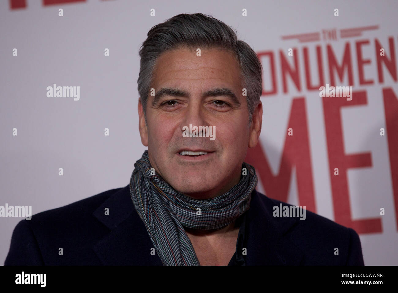 UNITED KINGDOM, London : American actor George Clooney poses for a photo call in front of 'Cupid complaining to Venus' by Lucas Cranach which was a painting that belonged in Hitlers private collection, in conjunction with the film 'The Monument men' in central London on February 11, 2014 Stock Photo