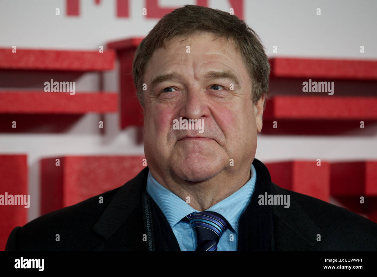 UNITED KINGDOM, London : American actor John Goodman poses for a photo call in front of 'Cupid complaining to Venus' by Lucas Cranach which was a painting that belonged in Hitlers private collection, in conjunction with the film 'The Monument men' in central London on February 11, 2014 Stock Photo