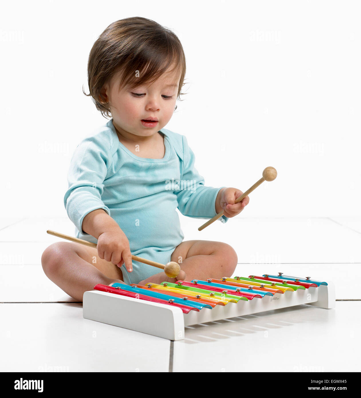 Baby boy playing toy xylophone Stock Photo