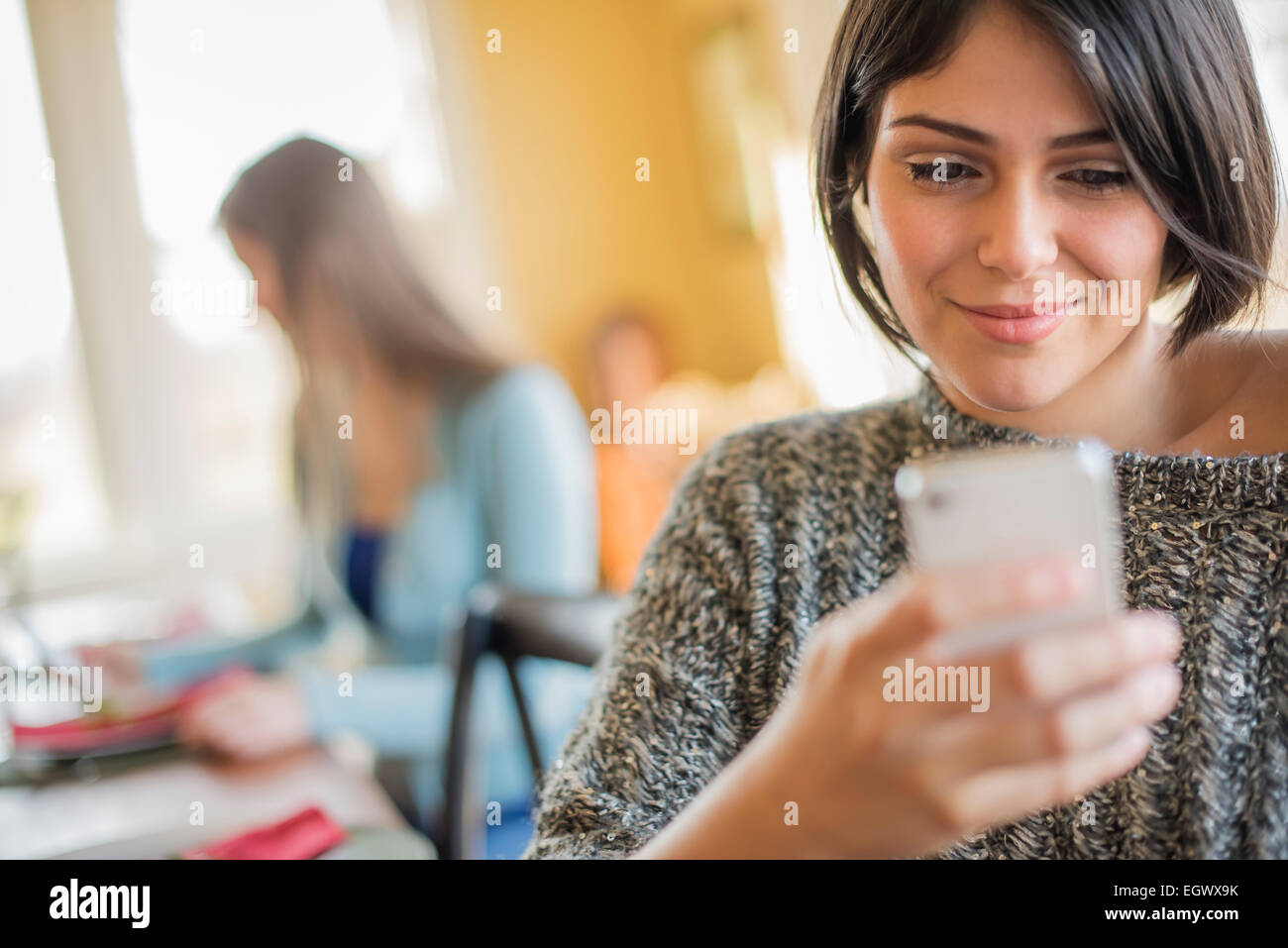 A woman checking her smart phone. Stock Photo
