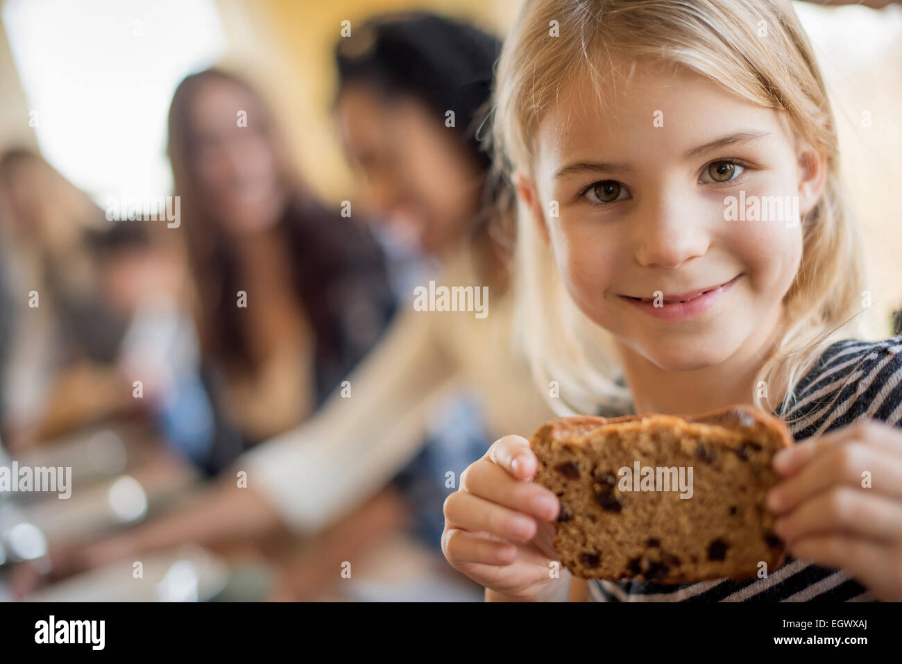 A young girl with a large cookie Stock Photo - Alamy