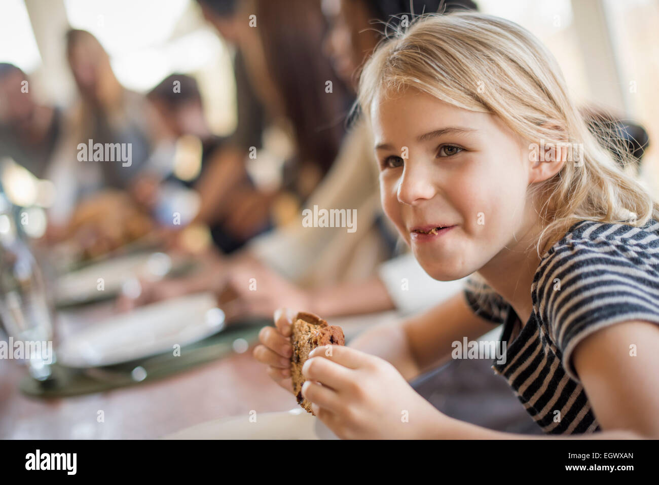 A young girl with a large cookie Stock Photo - Alamy