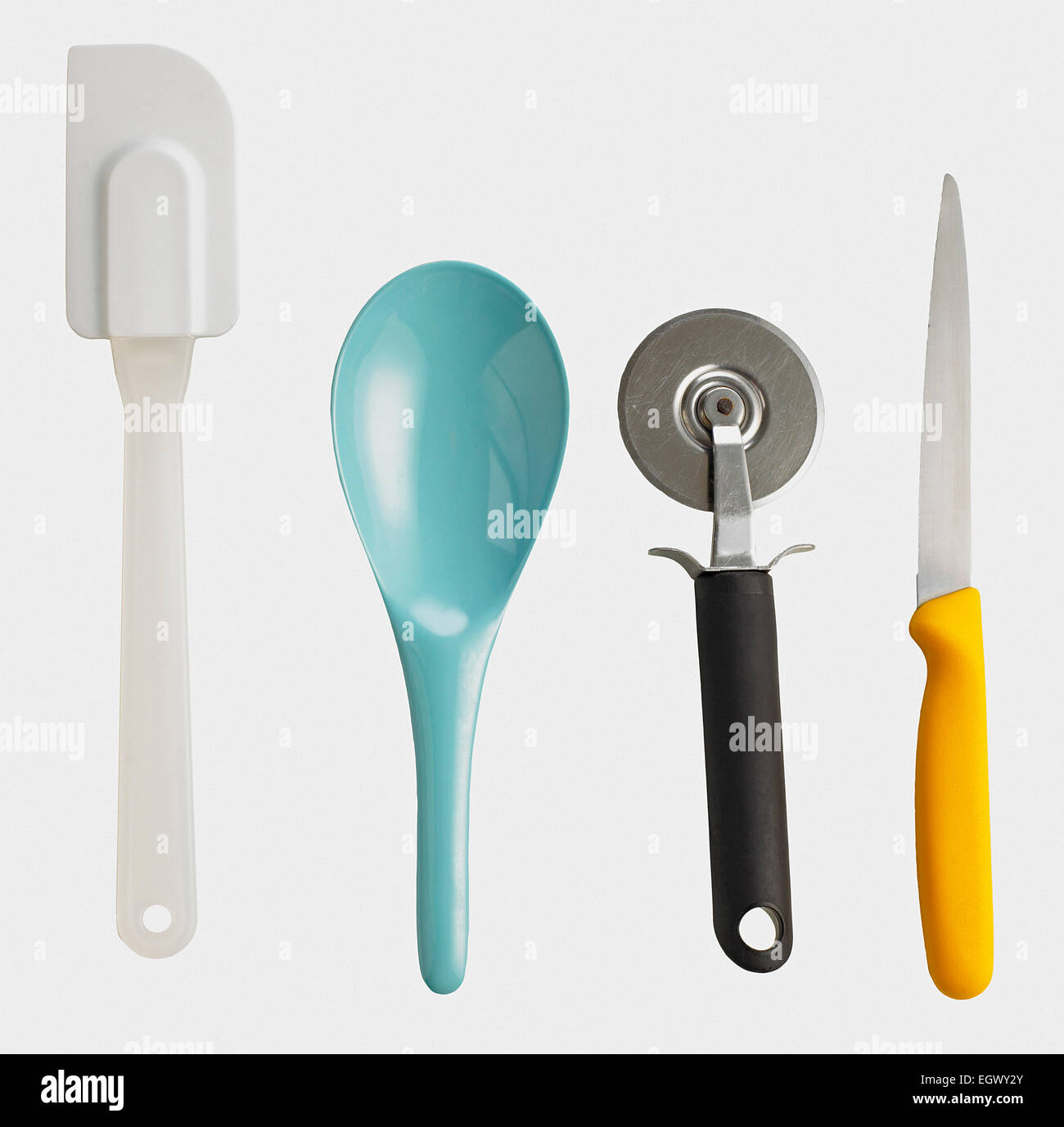 Spatula, large spoon, pizza cutter and sharp knife Stock Photo