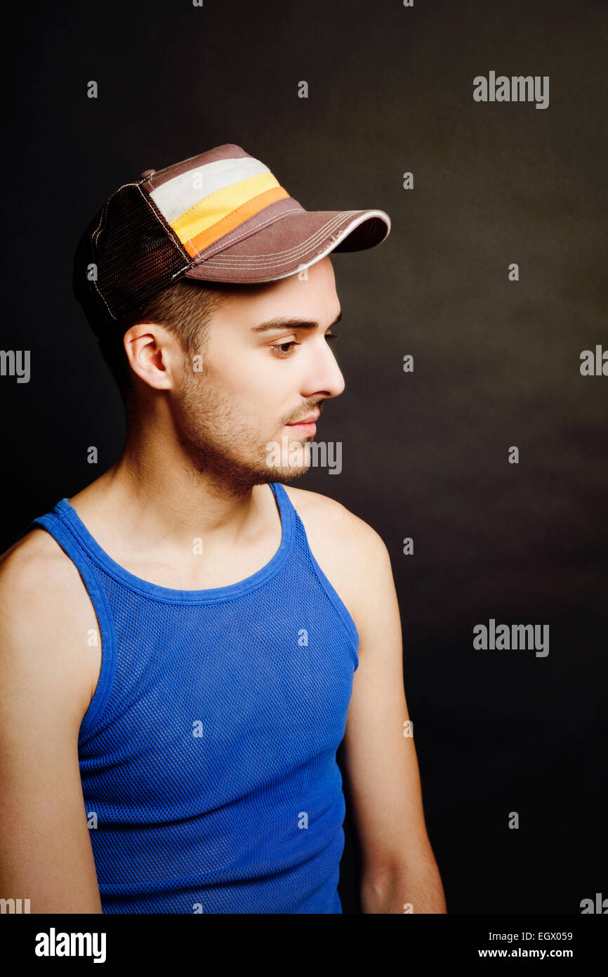 Man with Cap and String Vest in Studio Stock Photo - Alamy