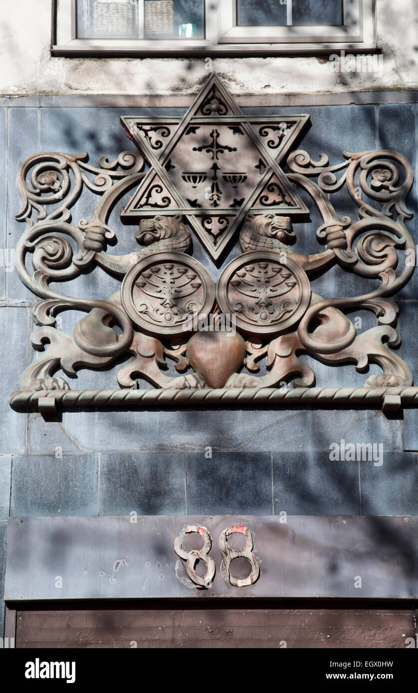 Sign above doorway of shop, formerly Jewish Daily Post Offices, on Whitechapel High Street in London E1 - UK Stock Photo