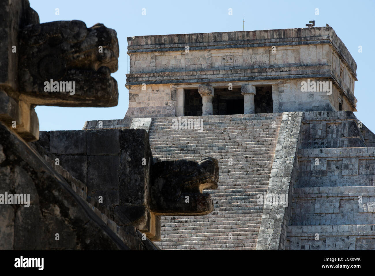 Jaguar heads on the Venus platform in front of El Castillo Chichen Itza, Yucatan, Mexico Stock Photo