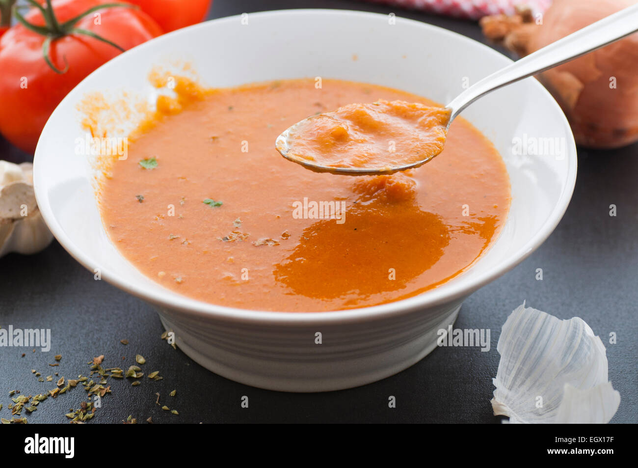 Homemade tomato soup freshly made from roasted tomatoes, onion, garlic and broth. Stock Photo